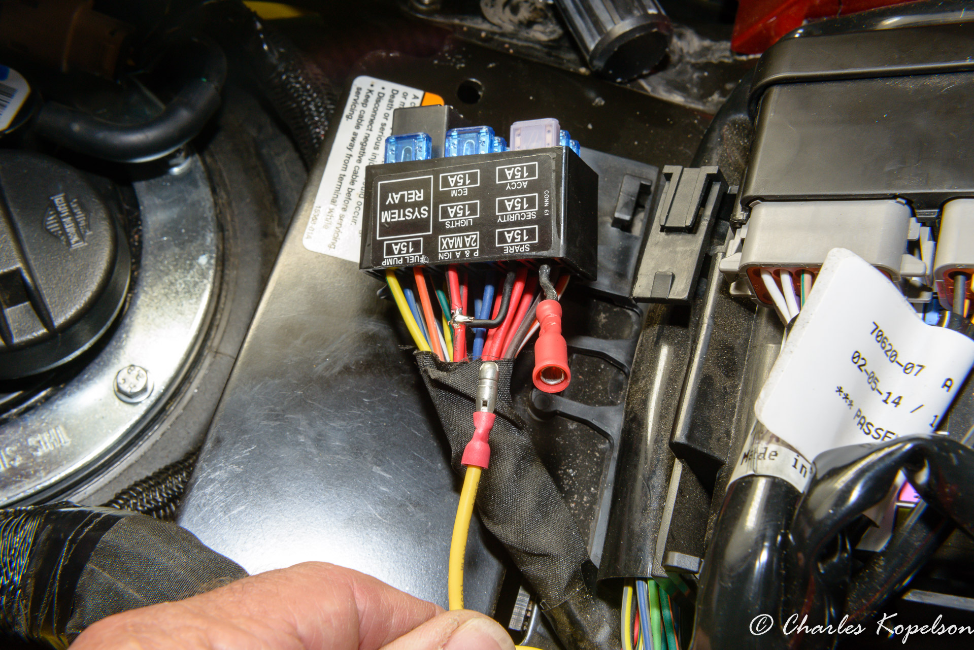 I tied one of the black wires around the red/ bk wire and soldered it.  This gave me a fuse block with an ignition source I could use without having to buy new terminal pins. I crimped a bullet connector to the second black  wire coming out of the fuse block and the yellow wire going to my aux light relay.