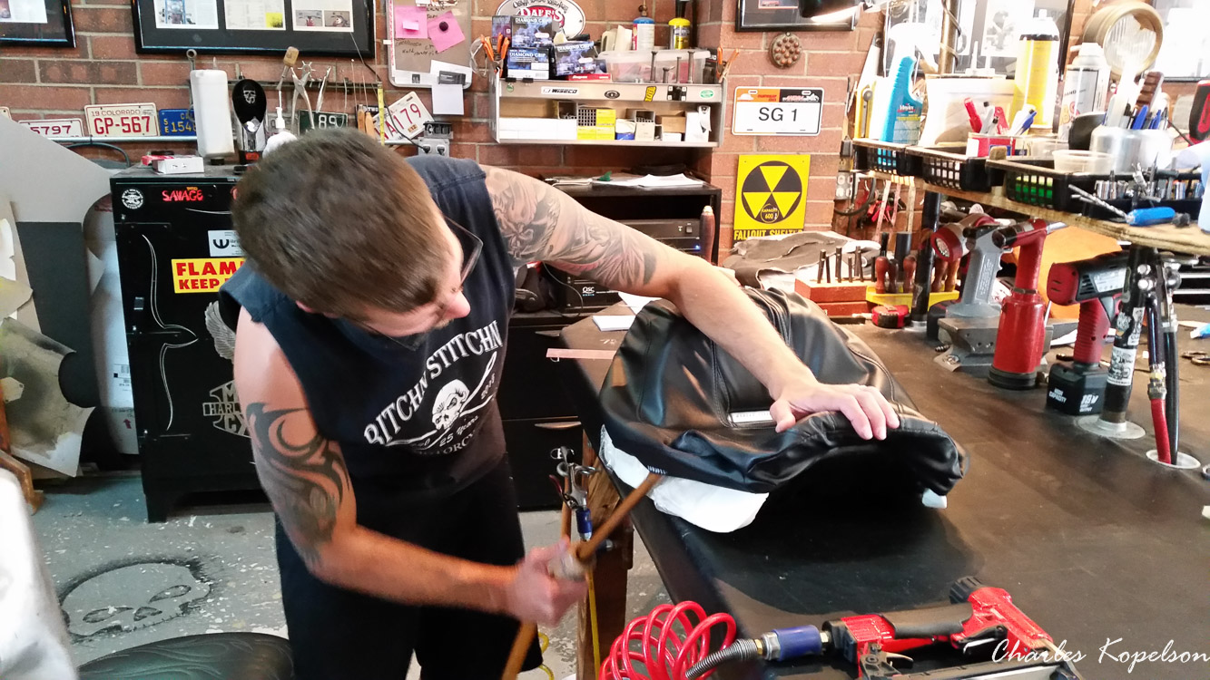I waited about 5 weeks to get an appointment for a custom seat fitting at Bitchin Stitchin in Lakewood Colorado. They tie the bike upright. You sit on the bike and they look at your posture. The seat is removed  from my 2014 Harley Davidson Night Rod Special VRSCDX.